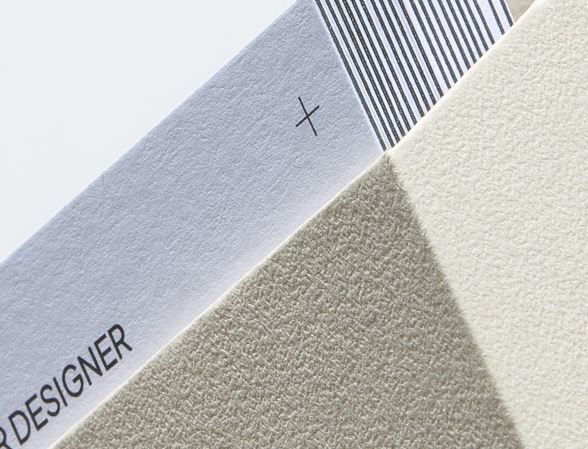 A detail image of the corner of white boxed luxe business cards.