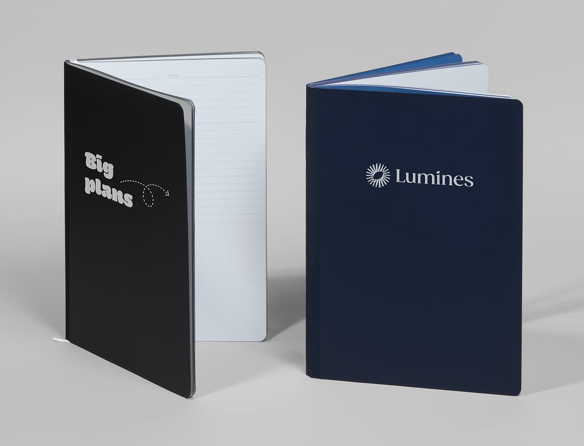 Two customised softcover planners standing.