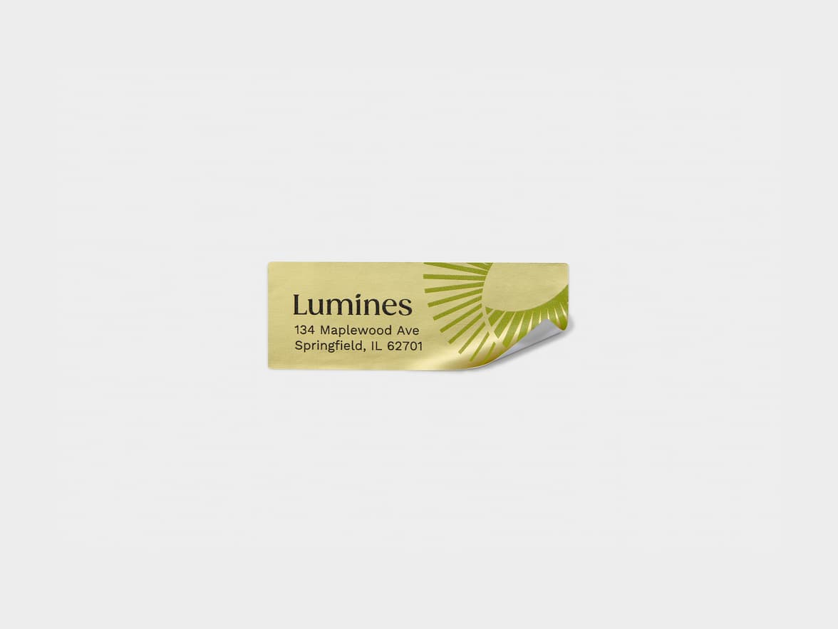 A rectangular gold metallic sticker with green branding.