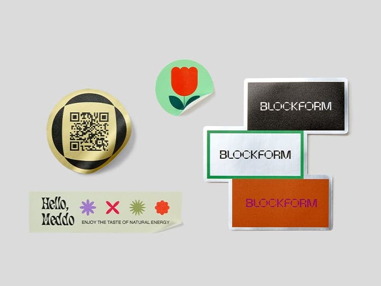 A collection of customized stickers varying in size, shape and paper type.