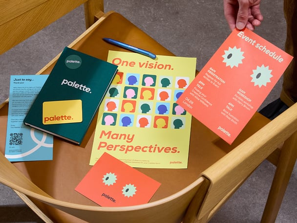 A selection of event marketing materials on a chair