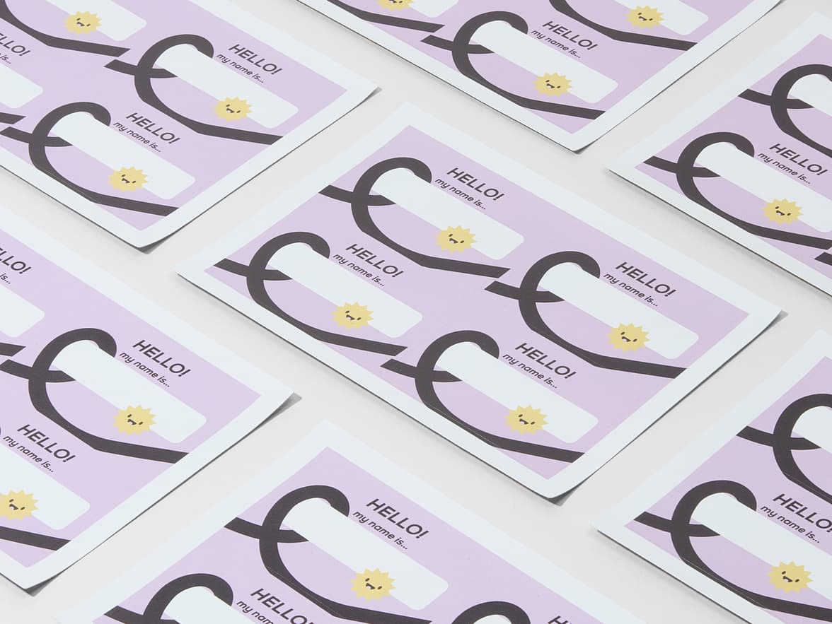 A collection of customized lilac rectangular name tags.