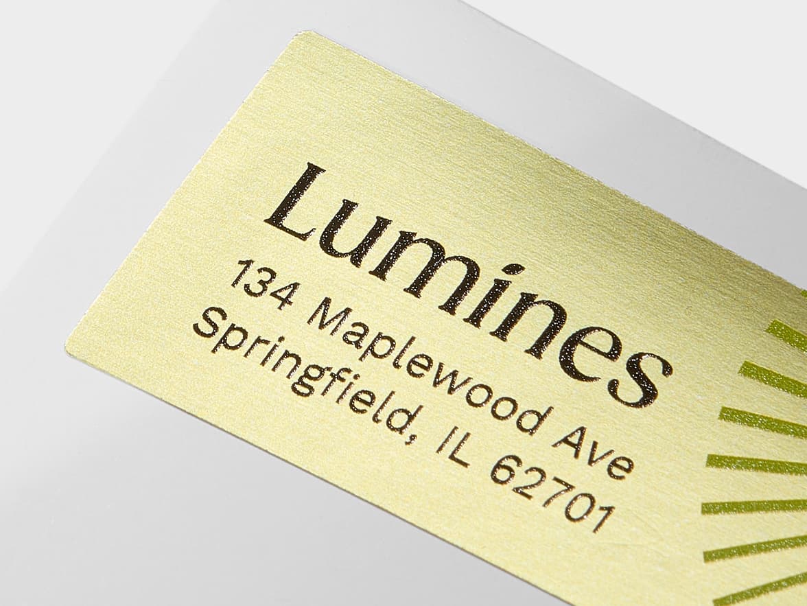 A close up image of a rectangular gold metallic sticker with customization.