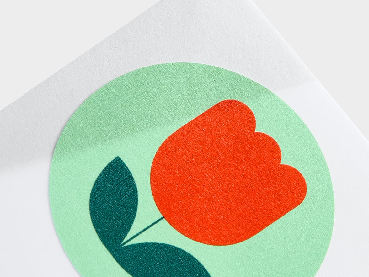 A close up image of a customized round matte finish sticker in size 2 inch.
