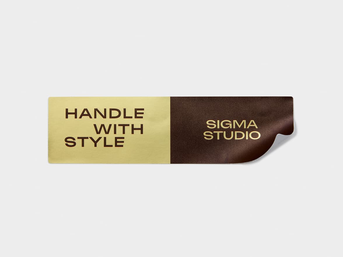 A gold and brown metallic customized rectangular sticker.