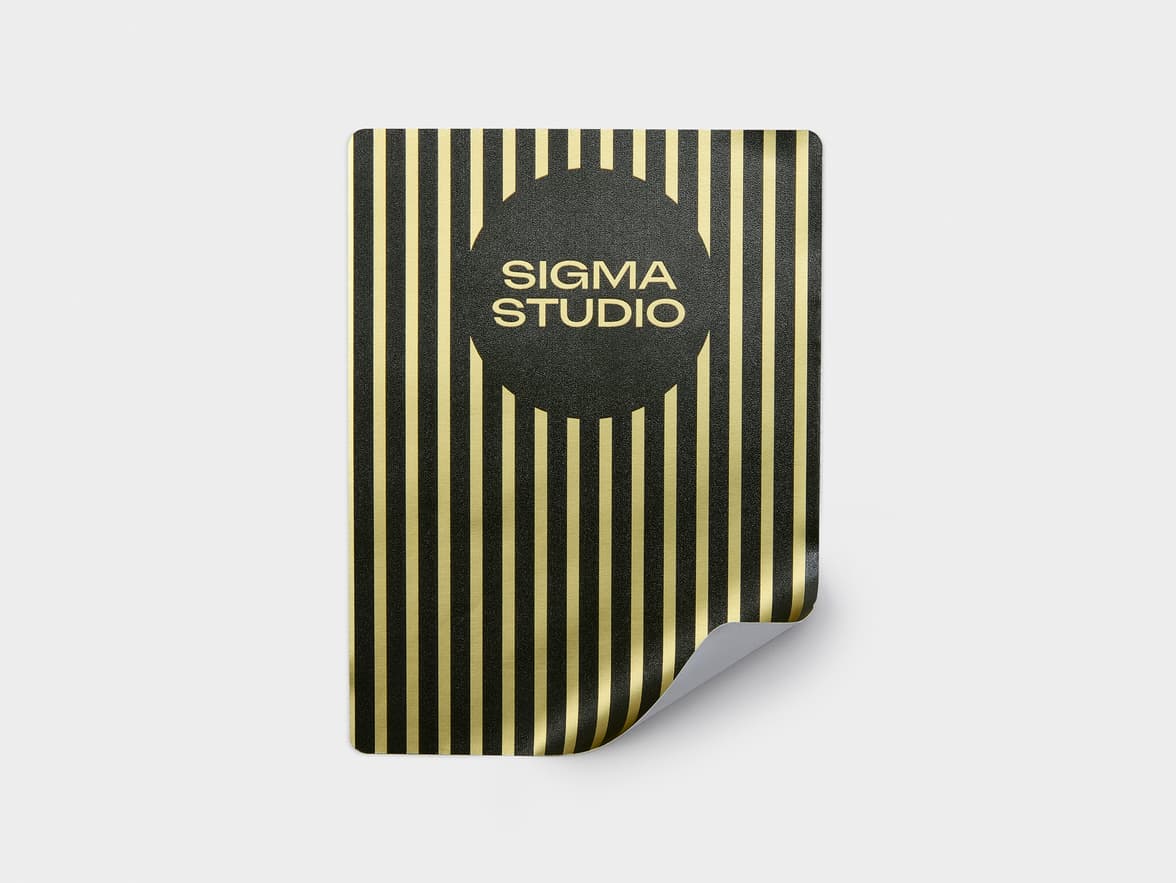 A gold and black metallic rectangular sticker with customization.