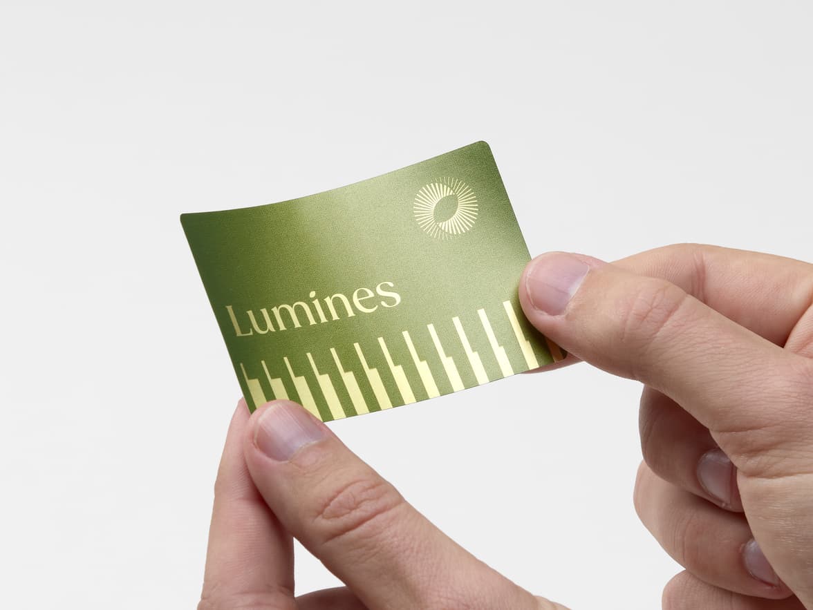 Hands holding a rectangular personalized gold foil stickers with customization.