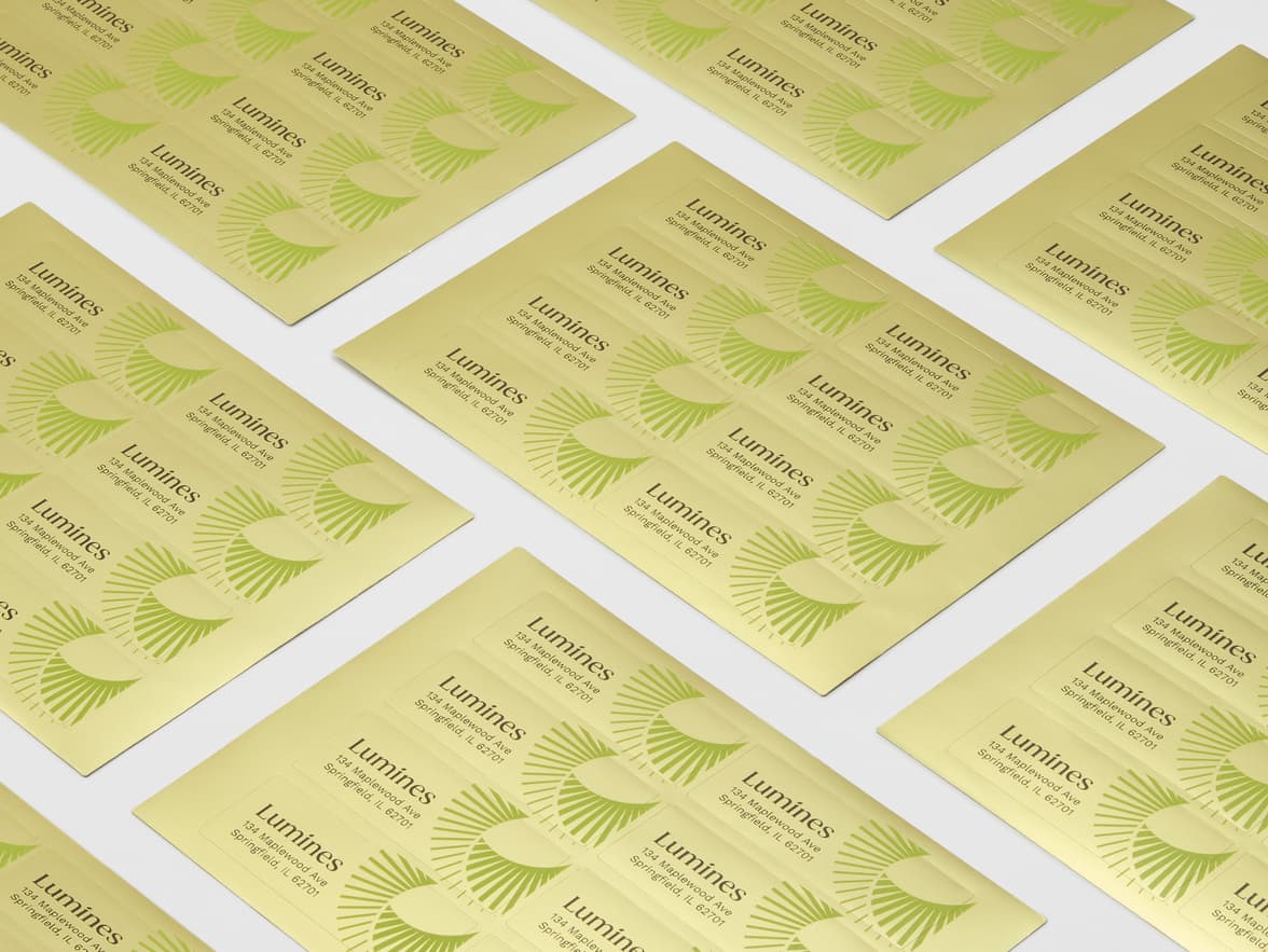 A collection of rectangular gold metallic stickers on sheets.