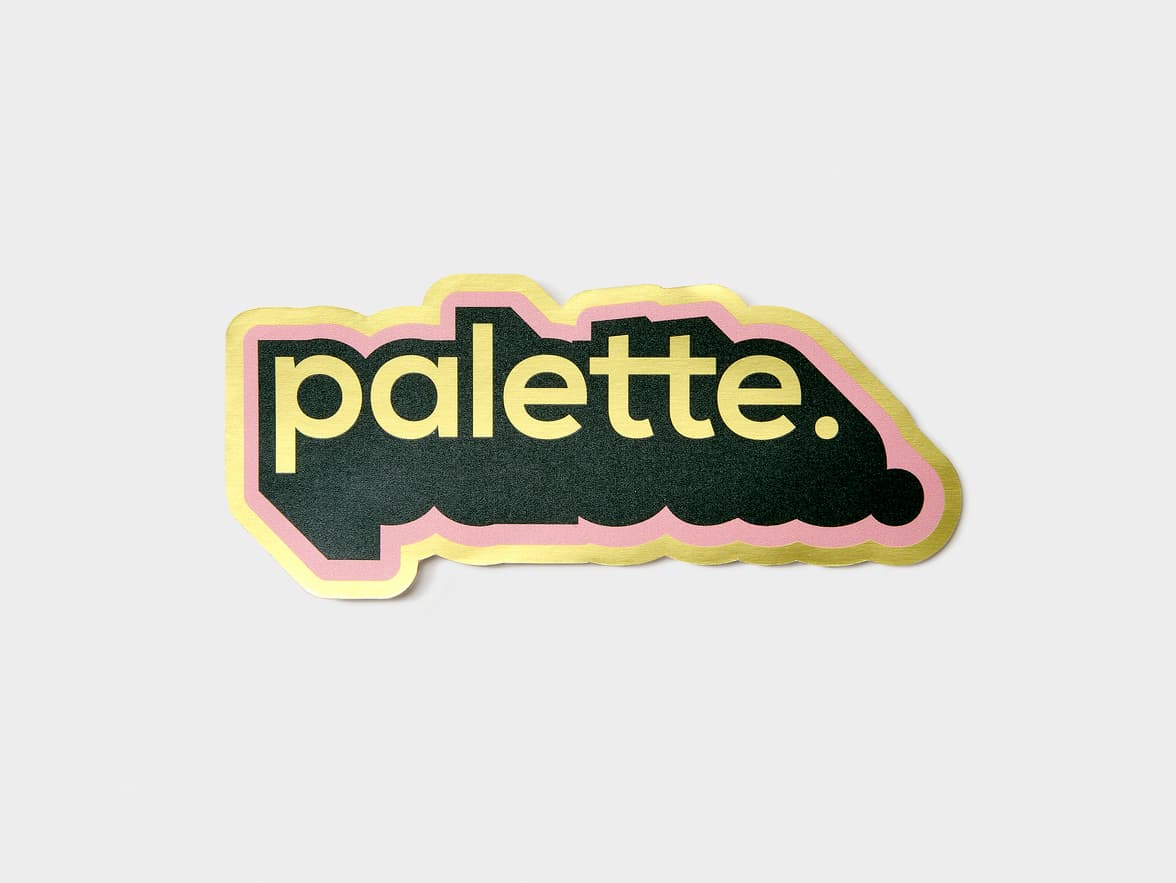 A customized gold metallic sticker in the design and shape of the word 'palette'.